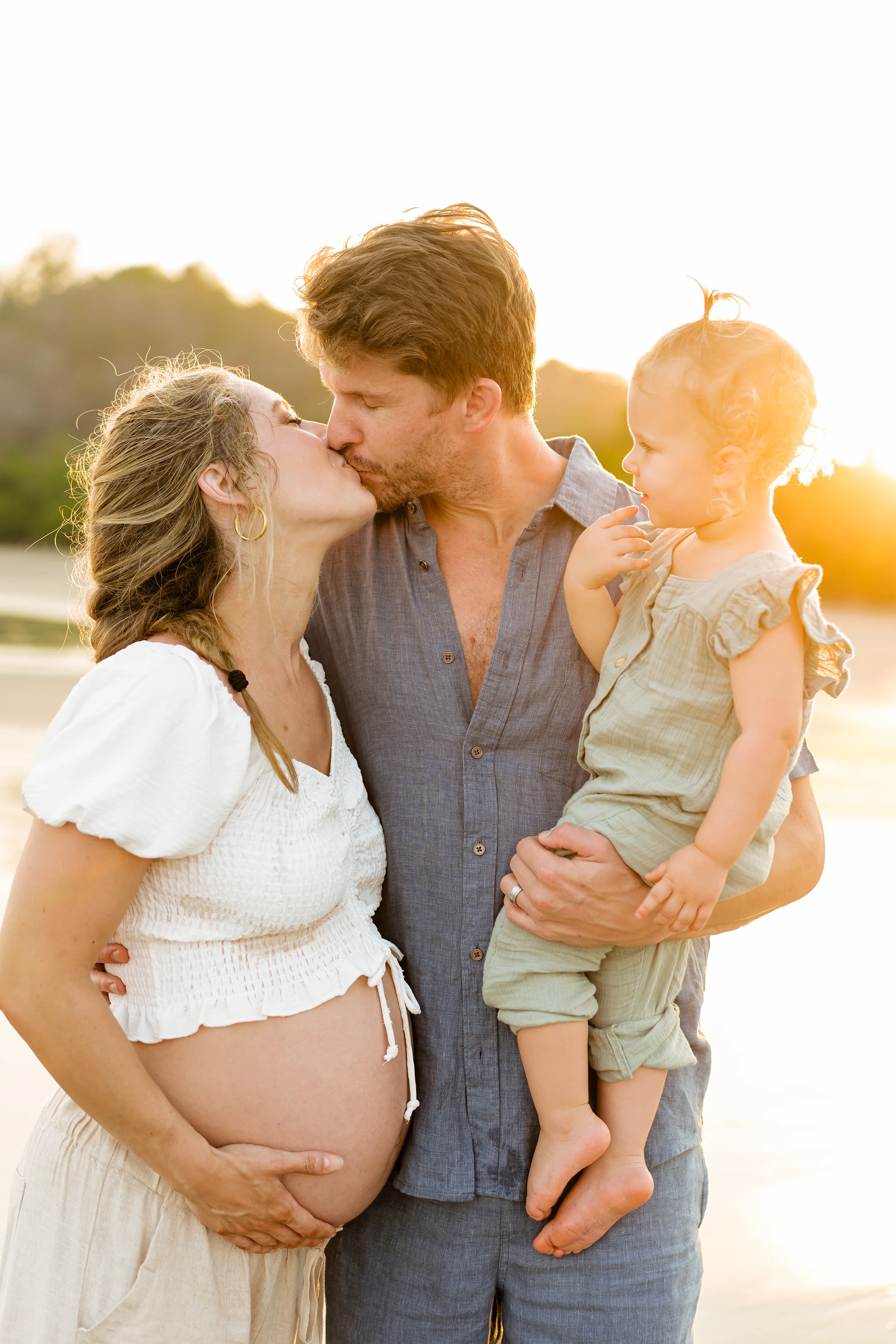 Family portrait at golden hour on beach
